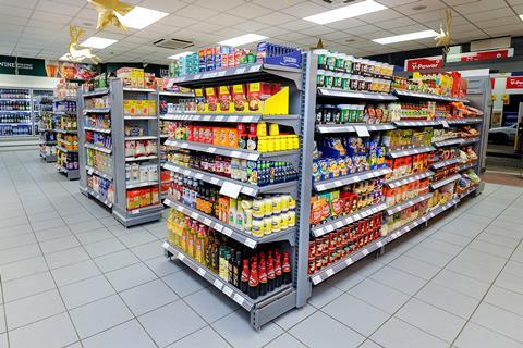 Essential groceries such as condiments, cooking sauces, rice and canned goods fill the shelves at the first Morrisons Daily store in Crewe.